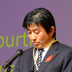 Reading  the message from Prime Minister Noda