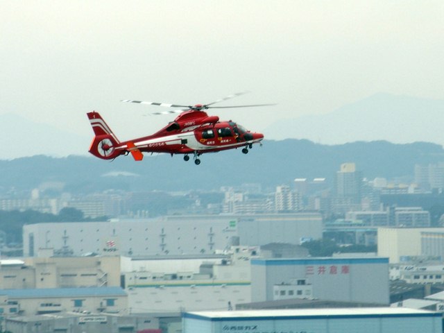 Fire extinguishing helicopter circling above the conference venue